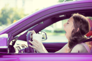 woman yawning while driving